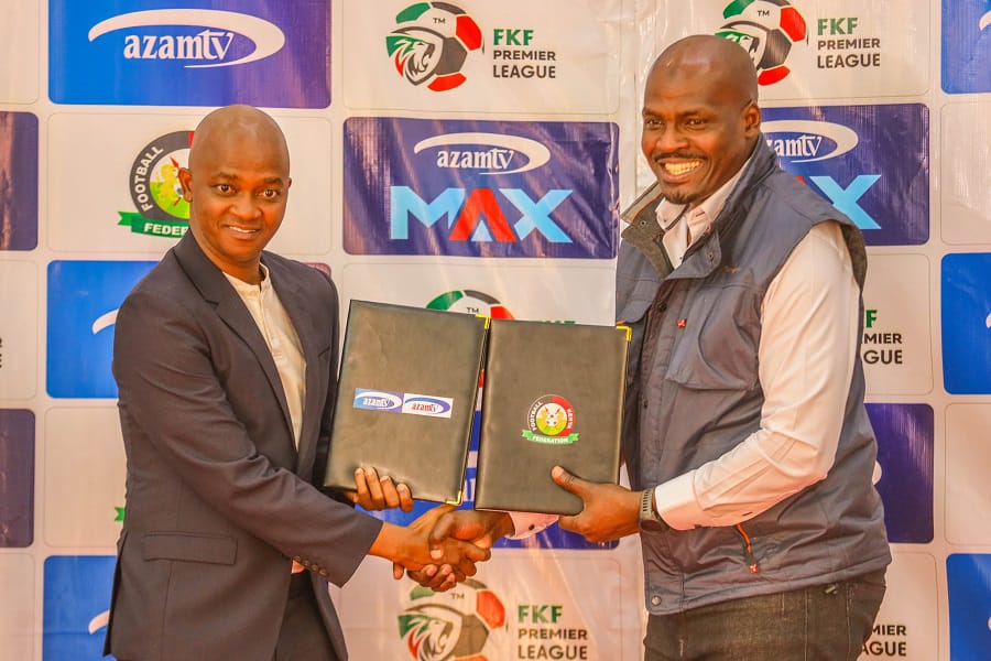 Football Kenya Federation (FKF), President Nick Mwendwa (left) exchange partnership documents with Azam Media Ltd chief Operations officer Yahya Mohamed during the partnership unveiling ceremony held at Nairobi’s Boma Hotel earlier today.