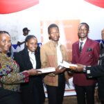 KNBS Snr Manager,NAS Benjamin Muchiri (right) and KNBS HR Manager and Dir Rose Awino(left) present Statistics learning books to TUK after giving a keynote speeches on career talk ,health and HIV/AIDS Awareness in Nairobi on 1st Dec 2023
